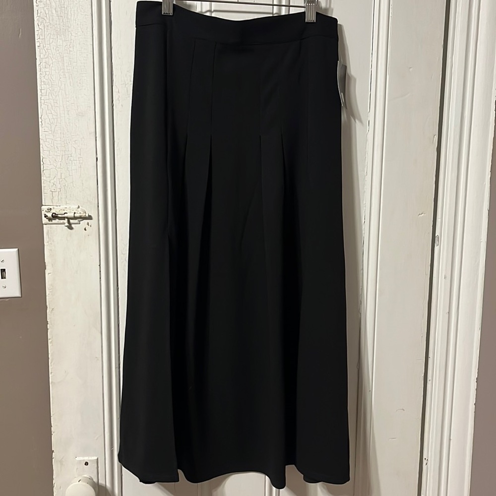 NEW- Black long skirt. With two slits.  Brand new